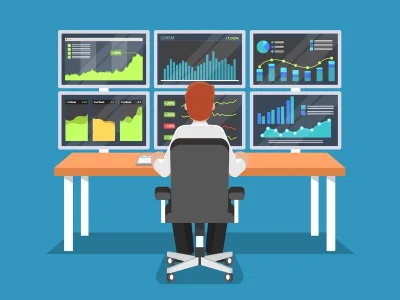 Analyst monitoring six dashboard screens for real-time analytics